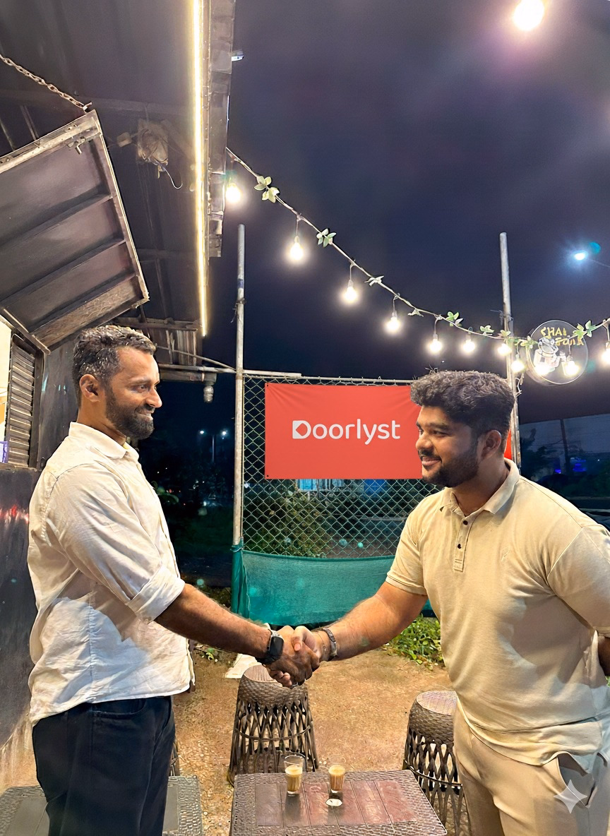 Wood tables with blue vases against a mural wall