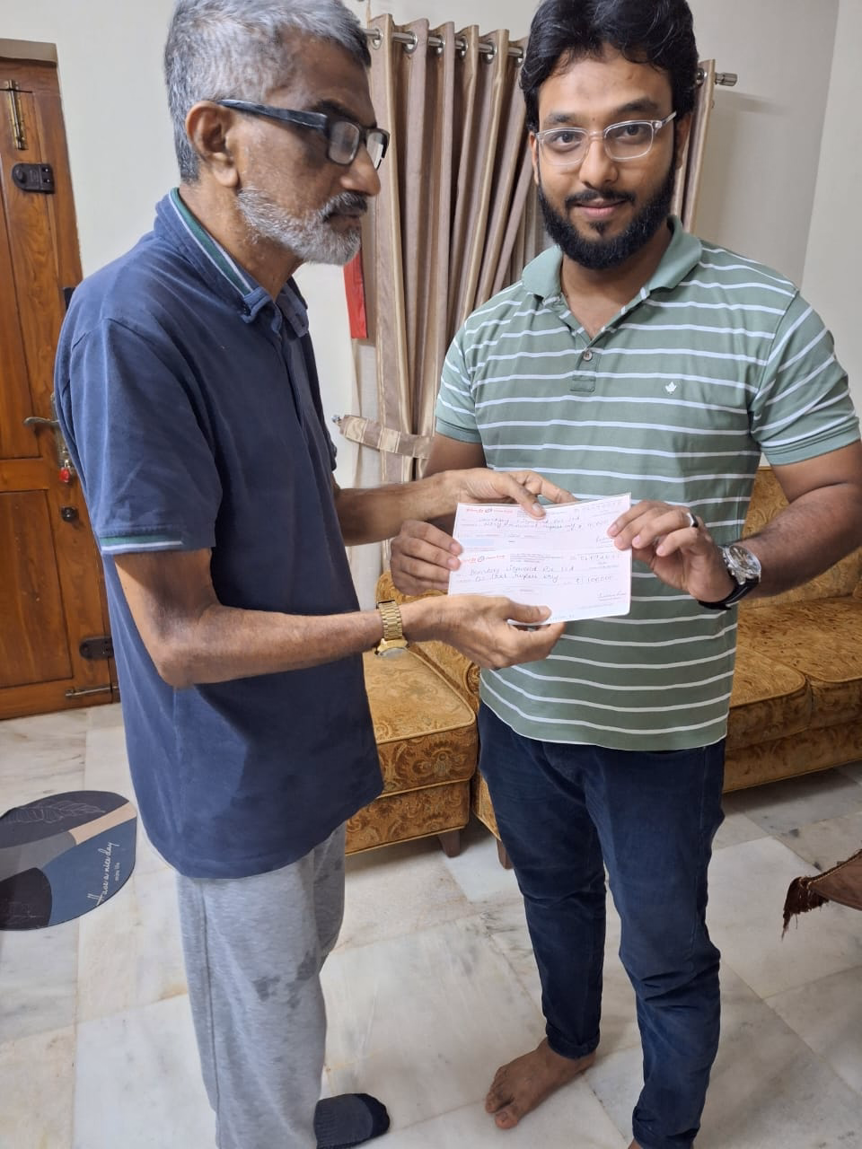 Dining room with glass table and beige chairs